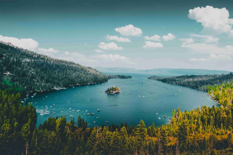 Beautiful aerial photo of Lake Tahoe and the surrounding trees on the mountains.