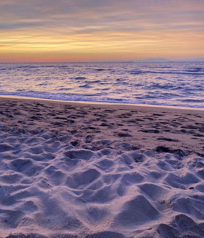 The beach and surf during sunset at Virginia Beach.